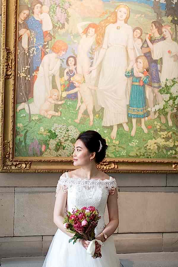 bride with flowers during photo shoot