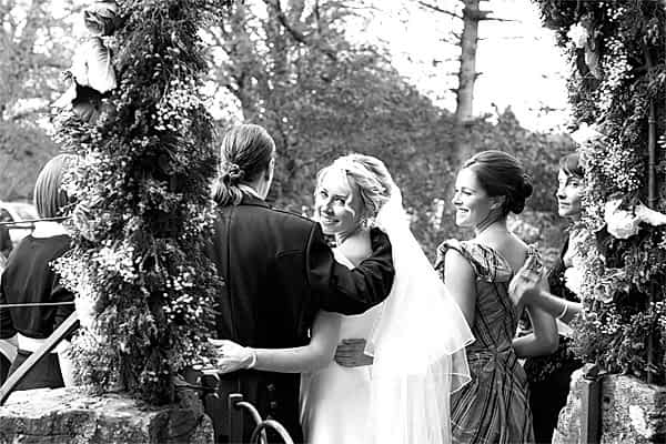 bride looking at photographer during wedding