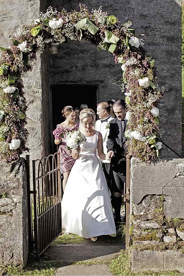 bride and groom exiting church after ceremony