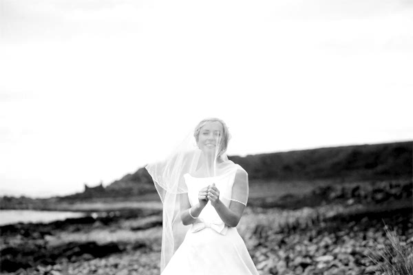 bride on a beach during wedding photo session