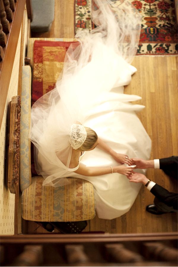 wedding photographer glasgow bride and groom holding hands during wedding reception at home in glasgow view from top