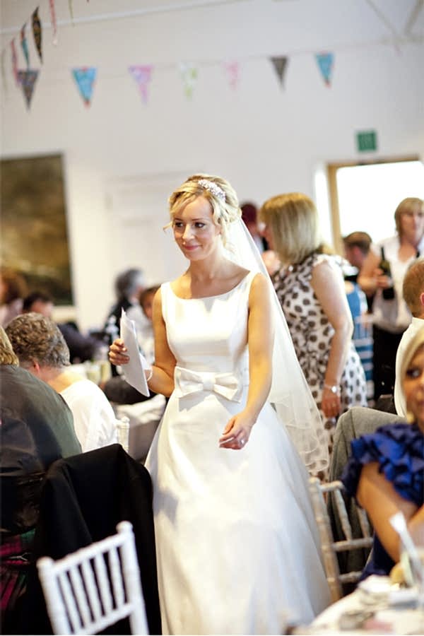 bride walking through tables