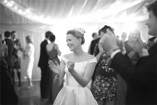 bride clapping after first few dances