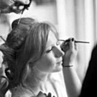 bride having make-up done preparatins for winter wedding at cameron house loch lomond scotland