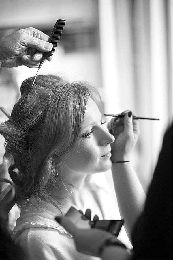 bride having make-up done preparatins for winter wedding at cameron house loch lomond scotland