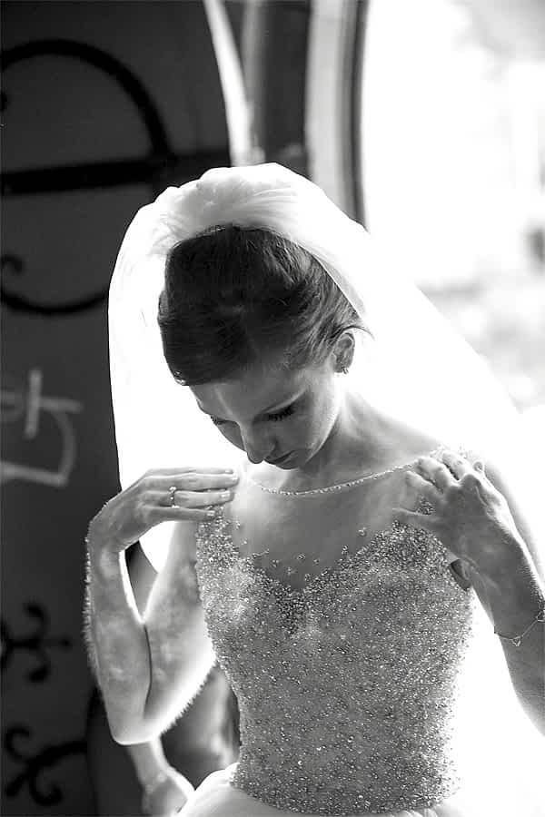 bride fixing her dress