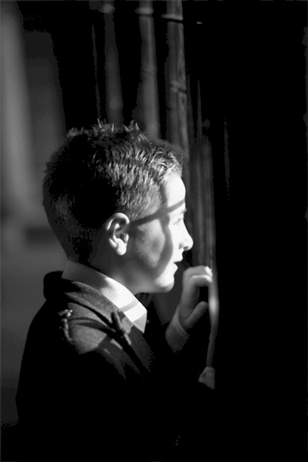 boy looking at bride through a window