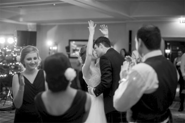 bride and groom kisses during dancing
