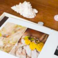 wedding album by Wedding Photographers Glasgow with wooden box and shell