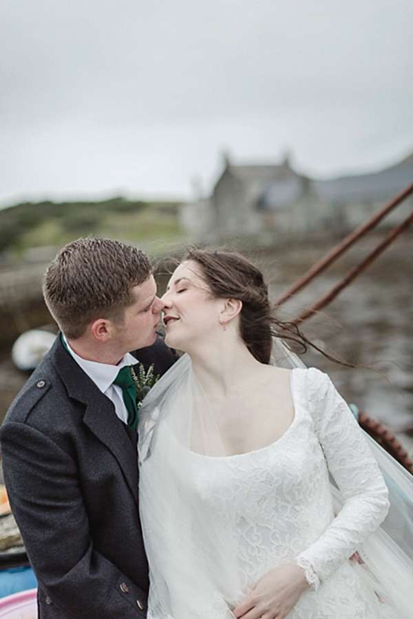 bride and groom about to kiss 
