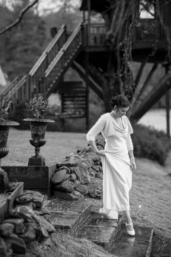 bride walking down stairs at the lodge on loch goil scotland