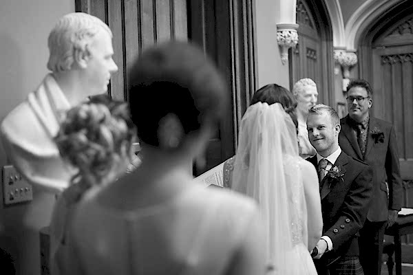groom looking at bride during ceremony