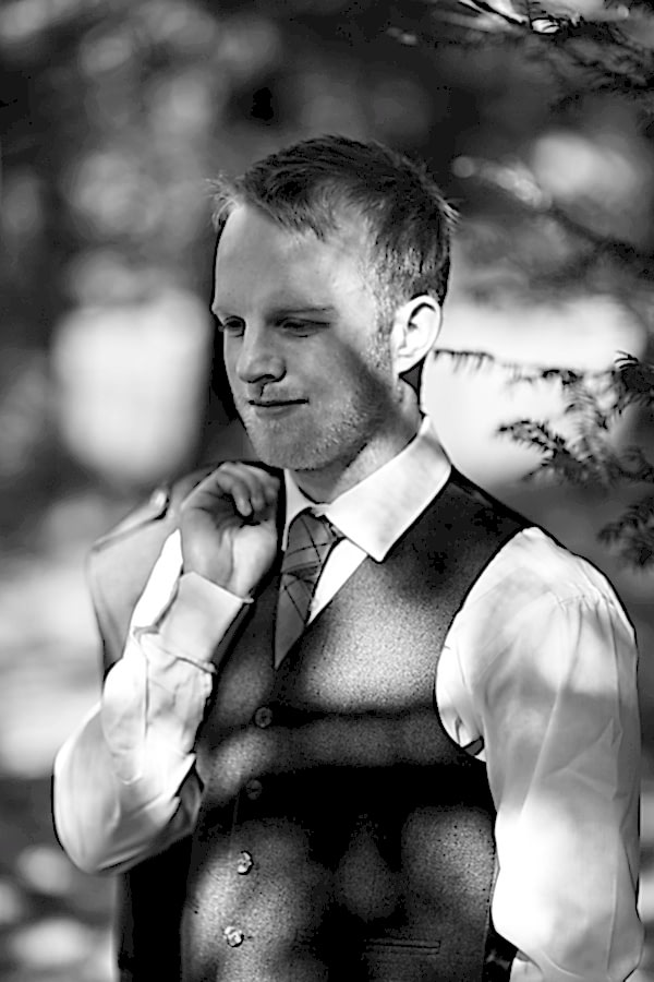 portrait of a groom in the gardens