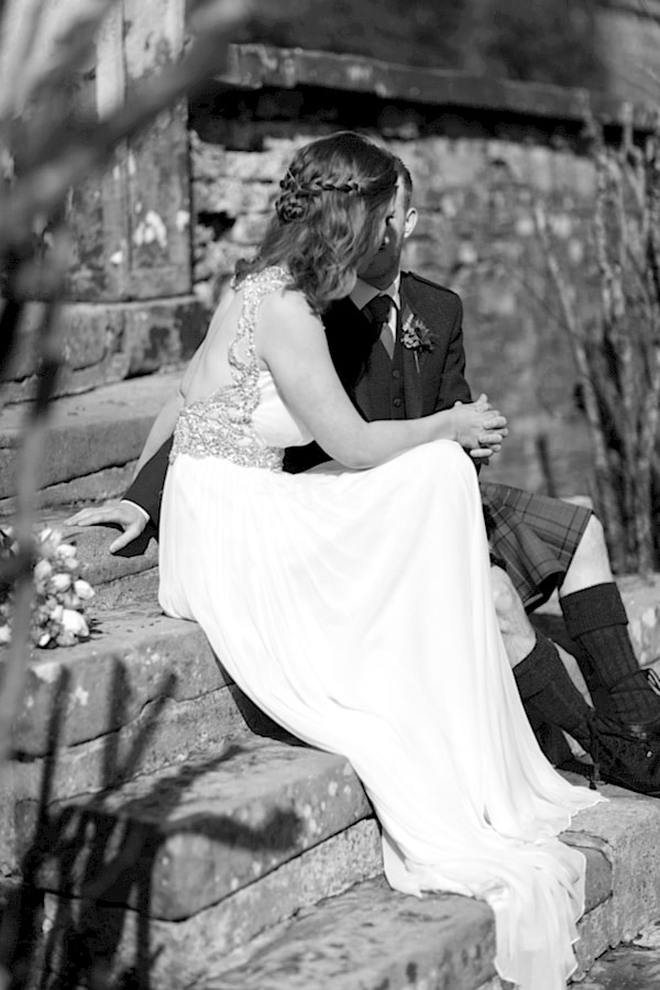 newlyweds holding hands at Blairquhan Castle gardens