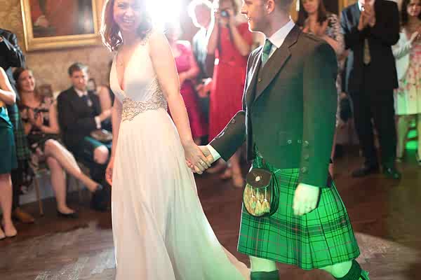 bride and groom walking into their first dance at Blairquhan Castle