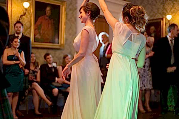 bridesmates dancing together on a wedding