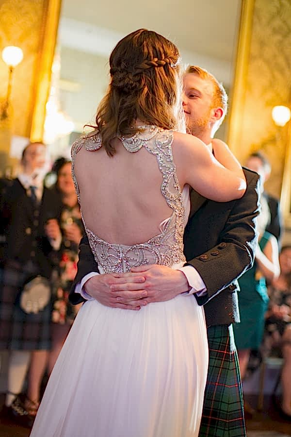newlyweds embraced during first dance