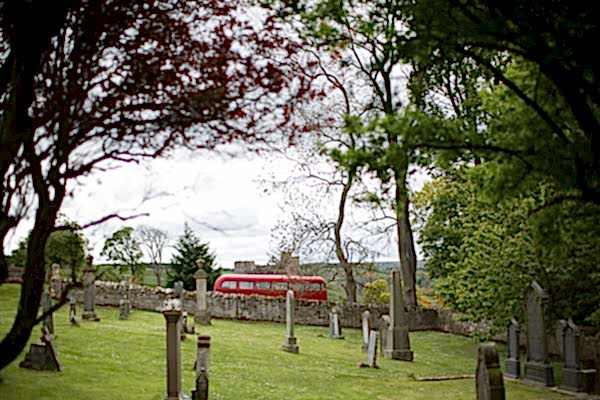 wedding bus parked next to church