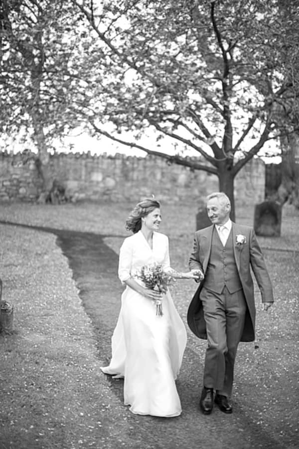 father ad bride looking at each other just before ceremony