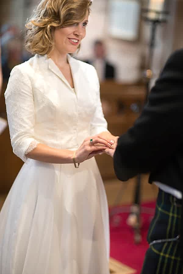 bride and groom exchanging wedding rings edinburgh scotland