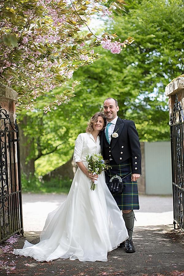 bride and groom embraced at church