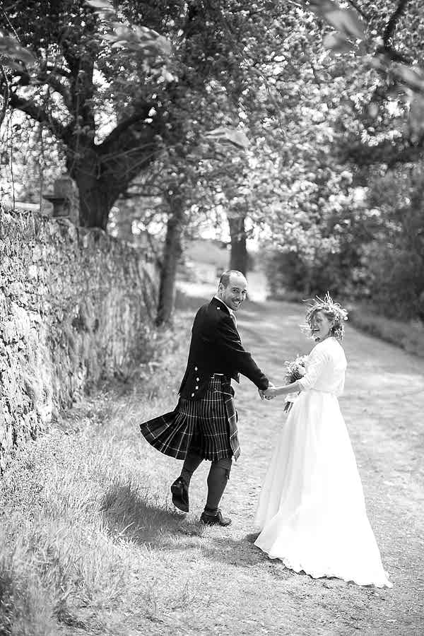 bride and groom walking away together