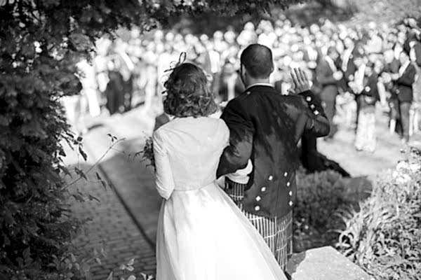 newlyweds arriving at the reception