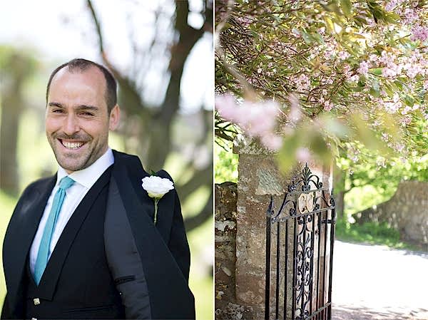 groom smiling and open gate to the church were ceremony beeing held