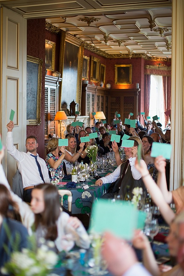 weddings guests playing quiz during speeches