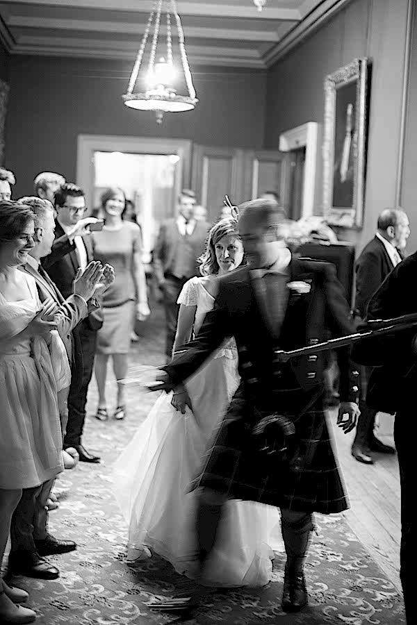 newlyweds walking in for cutting of the cake at oxenford castle