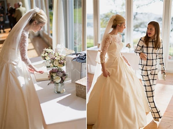 bride looking at her guest book and talking to guest