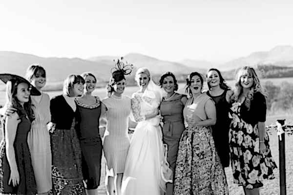 bride with her girlfriends laughing