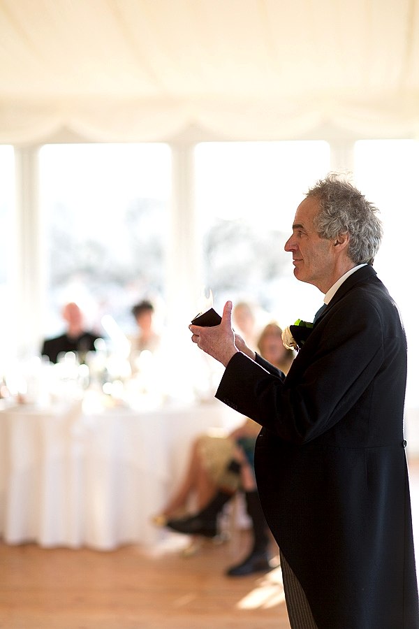 father doing a magic trick during his speech