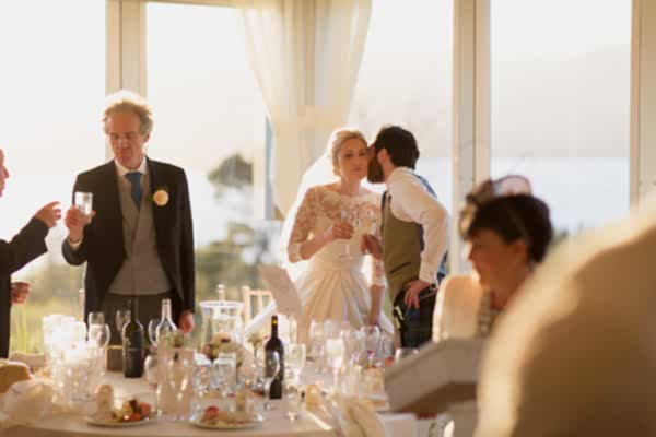 groom kissing bride after speeches