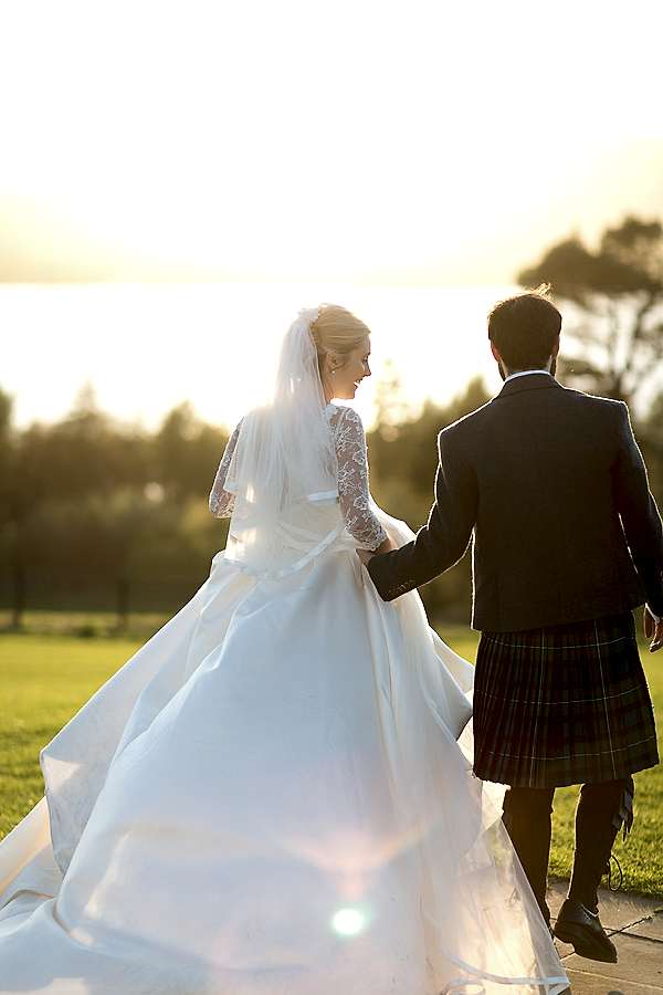 bride laughing while walking away