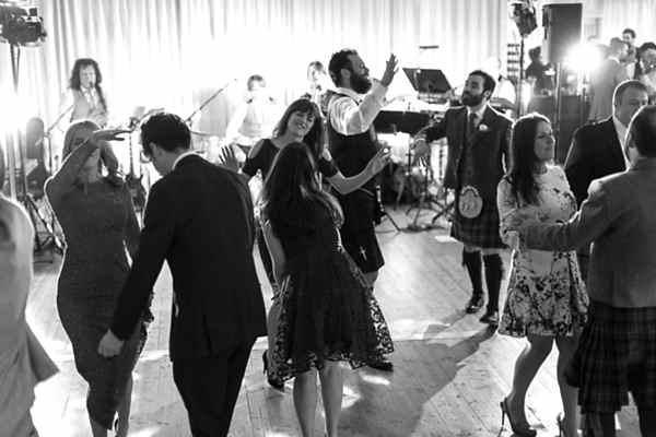 rock band playing and guests dancing