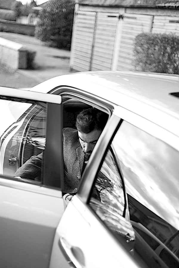 groom getting into a car