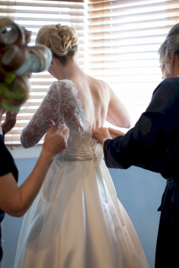 bride putting her dress