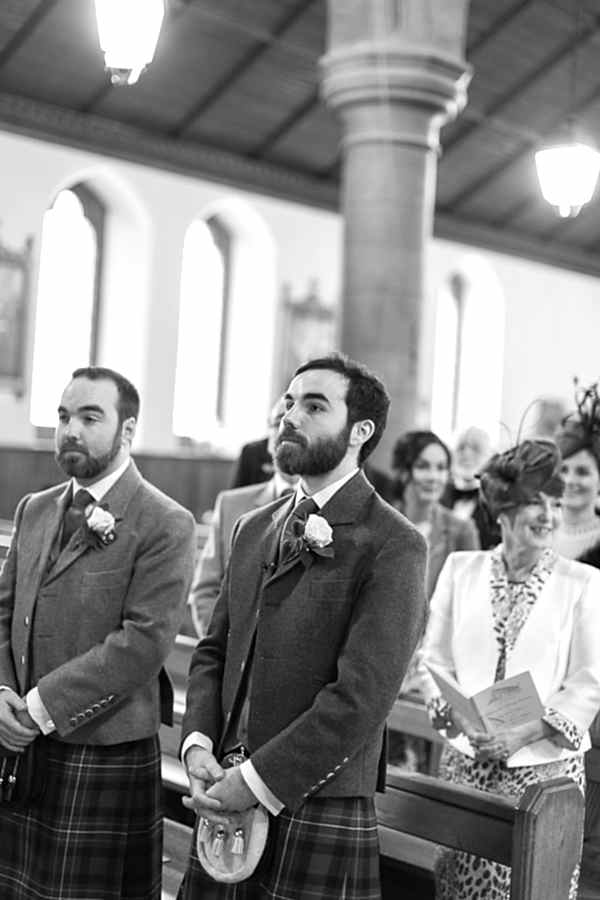 groom and best man wainting inside the church 