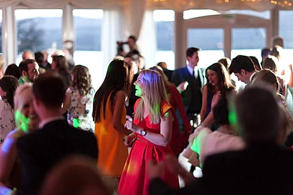 guests dancing with disco lights