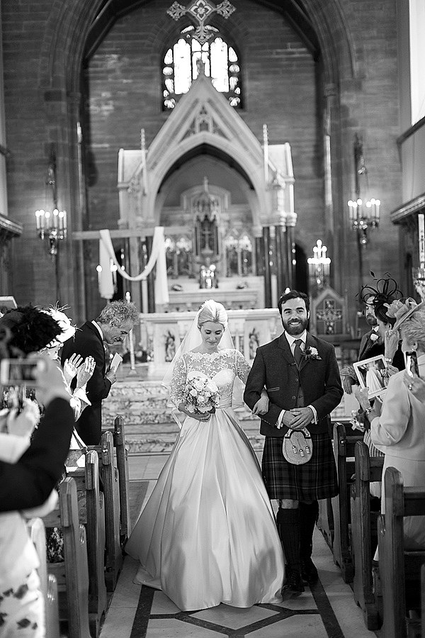 newlyweds walking down the aisle fotogenic of scotland