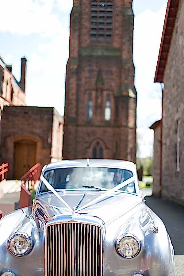 wedding car leaving the church