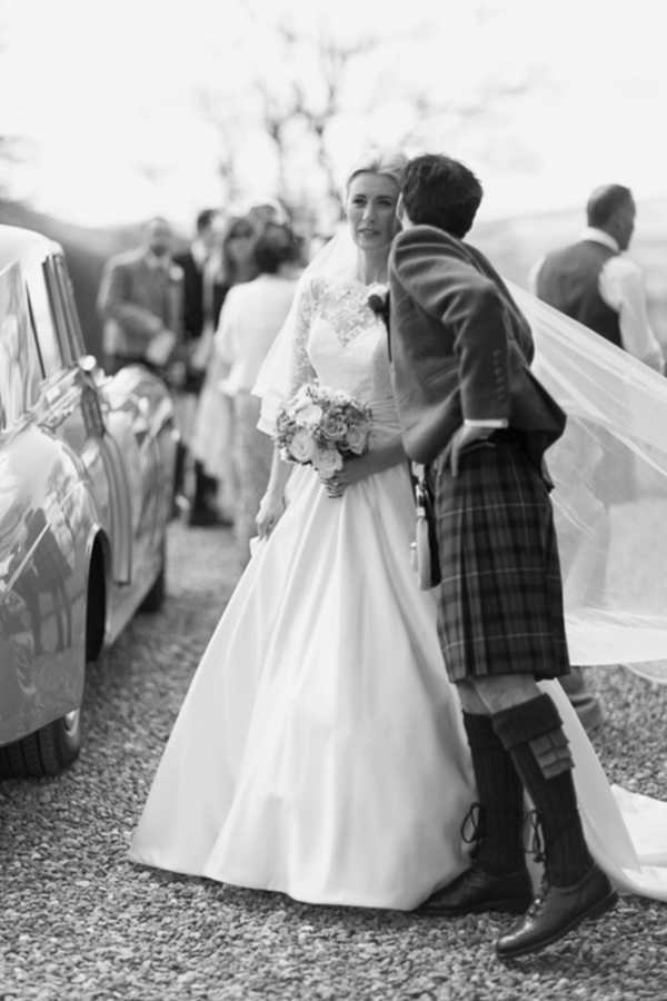 groom is kissing bride in a chick
