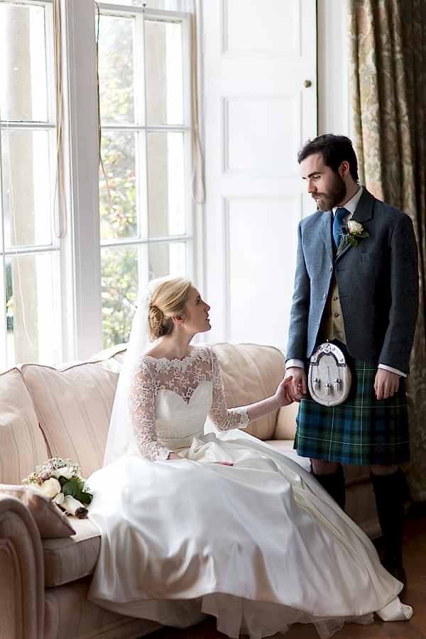 boturich castle wedding photos bride and groom holding hands