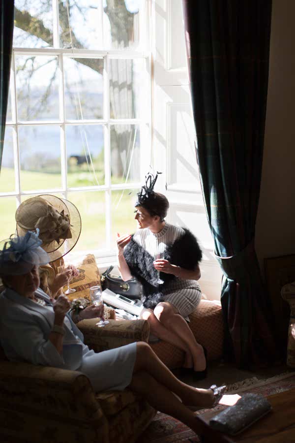 guests cahtting at the castle scotland wedding photos