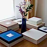 wedding albums photos on a table with flowers from glasgow scotland photographer