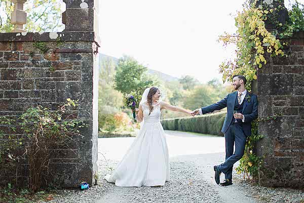 bride and groom holding hands wedding photos glasgow