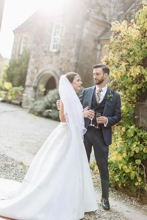 married couple drinking champagne at wedding venue in scotland