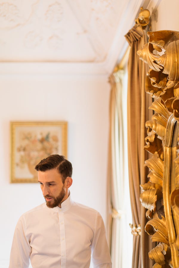 portrait of groom in white shirt