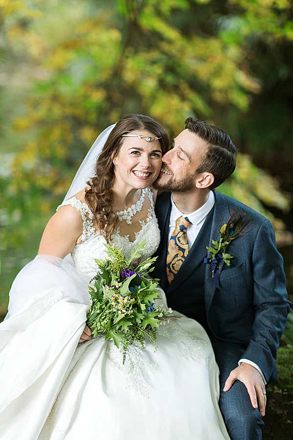 wedding photographers bride and groom happy kissing